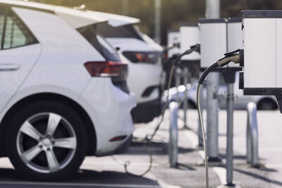 A parking lot with charging stations for electric cars.