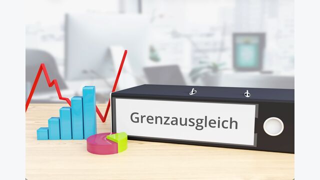 mappe neben statisitk-symbolen mit "Grenzausgleich" auf Rücken geschrieben